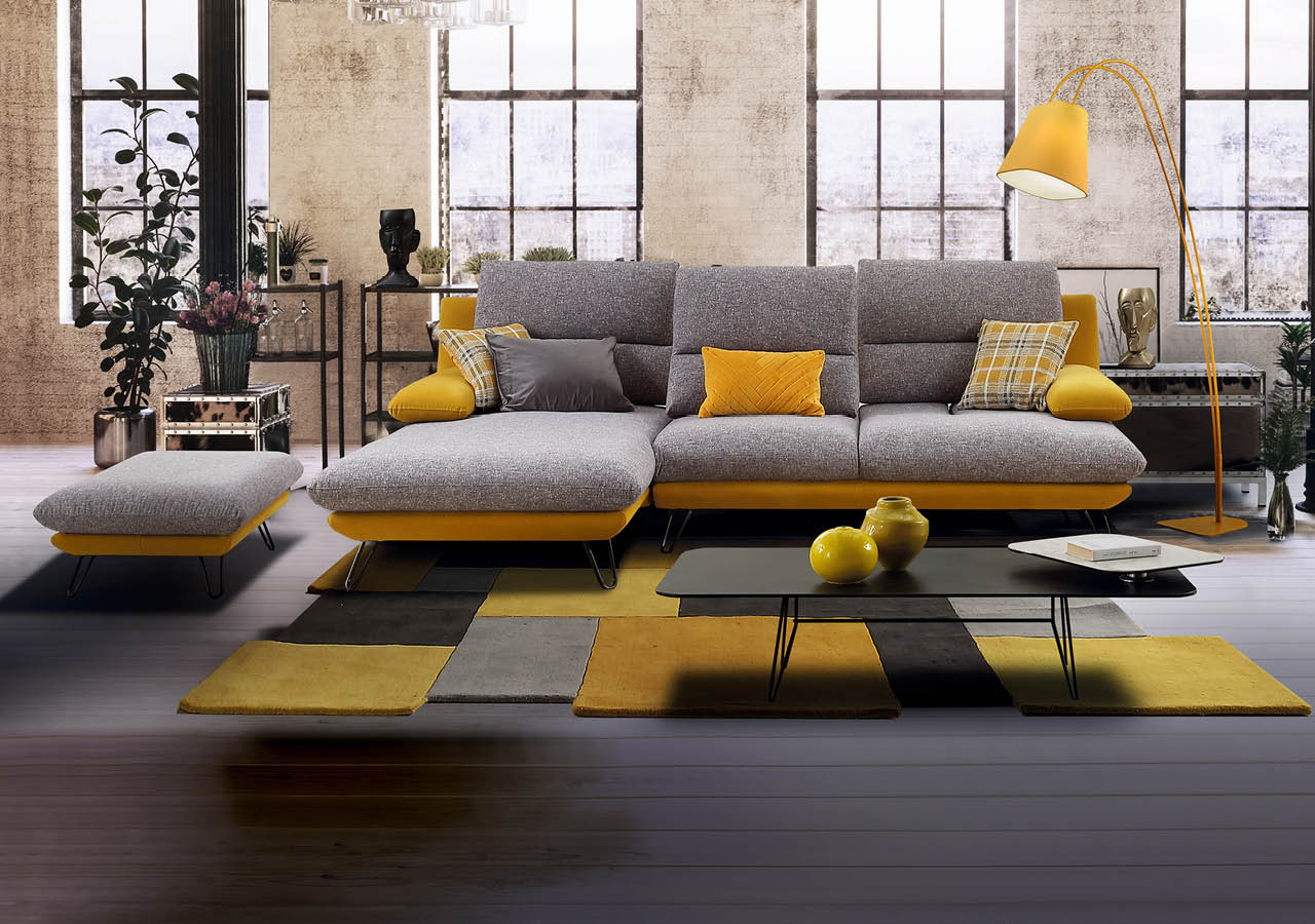 Converted loft interior with high graceful arched windows in a brick wall and modern lounge furniture with a potted tree and houseplants, 3d rendering