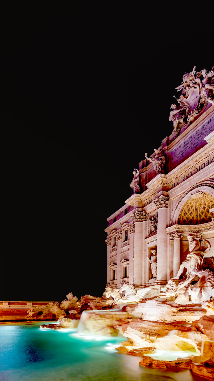 Trevi Fountain illuminated at night in the heart of Roma, Italy