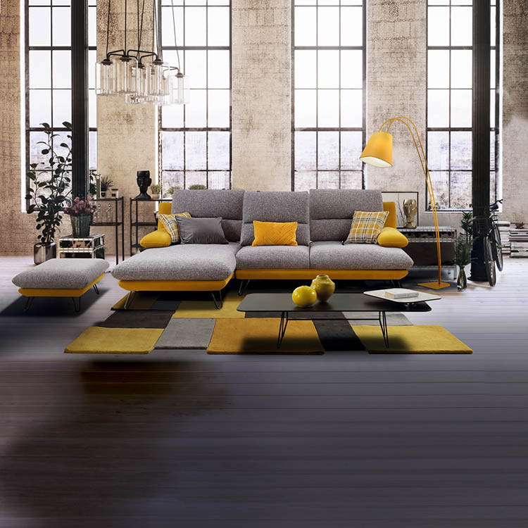 Converted loft interior with high graceful arched windows in a brick wall and modern lounge furniture with a potted tree and houseplants, 3d rendering